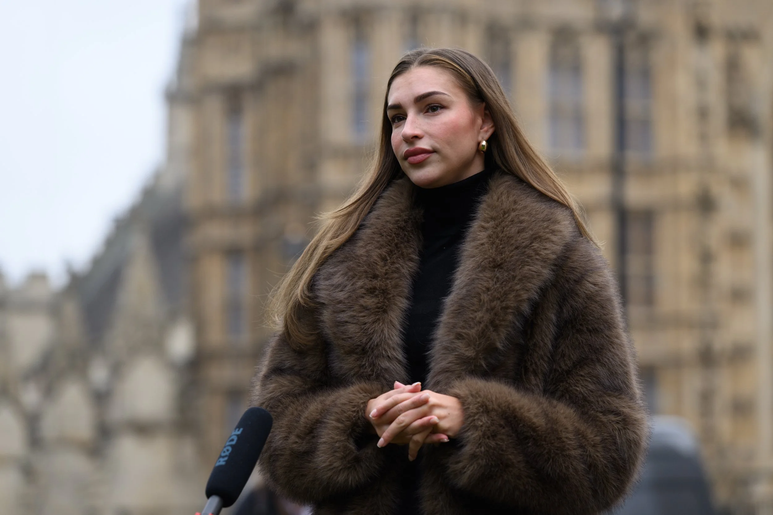 London, UK, 10th March 2026: Refuge brings their ?Home is Where the Hurt is? campaign to government today. Campaigners armed with placards and a coffin-shaped front door protest outside The Houses of Parliament. Picture shows documentary filmmaker and survivor Zara McDermott during the campaign event.