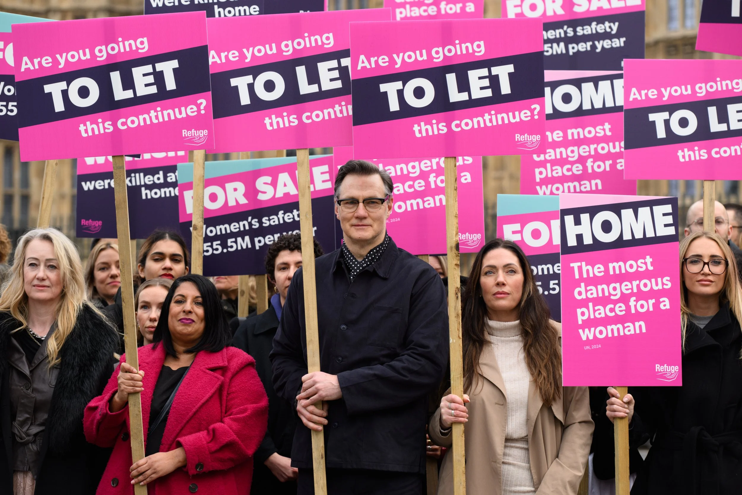 London, UK, 10th March 2026: Refuge brings their ???Home is Where the Hurt is??? campaign to government today. Campaigners armed with placards and a coffin-shaped front door protest outside The Houses of Parliament.