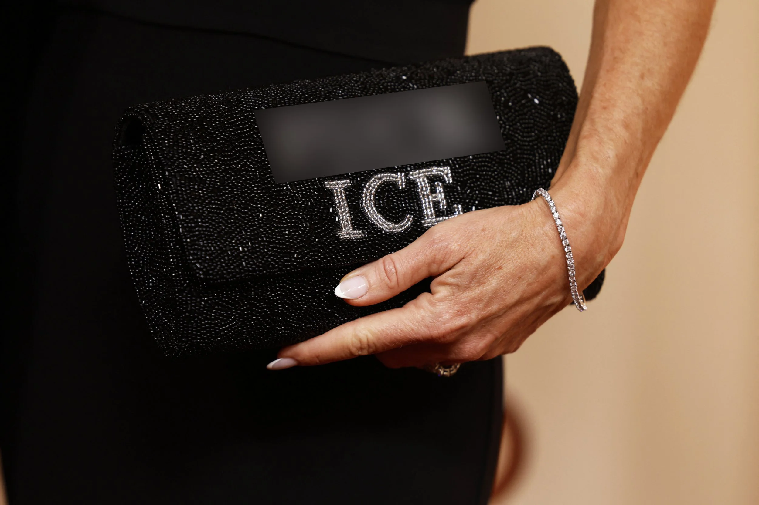 Glennon Doyle holds a purse that reads 'Fuck ICE' as she poses on the red carpet during the Oscars arrivals at the 98th Academy Awards in Hollywood, Los Angeles, California, U.S., March 15, 2026. REUTERS/Caroline Brehman
