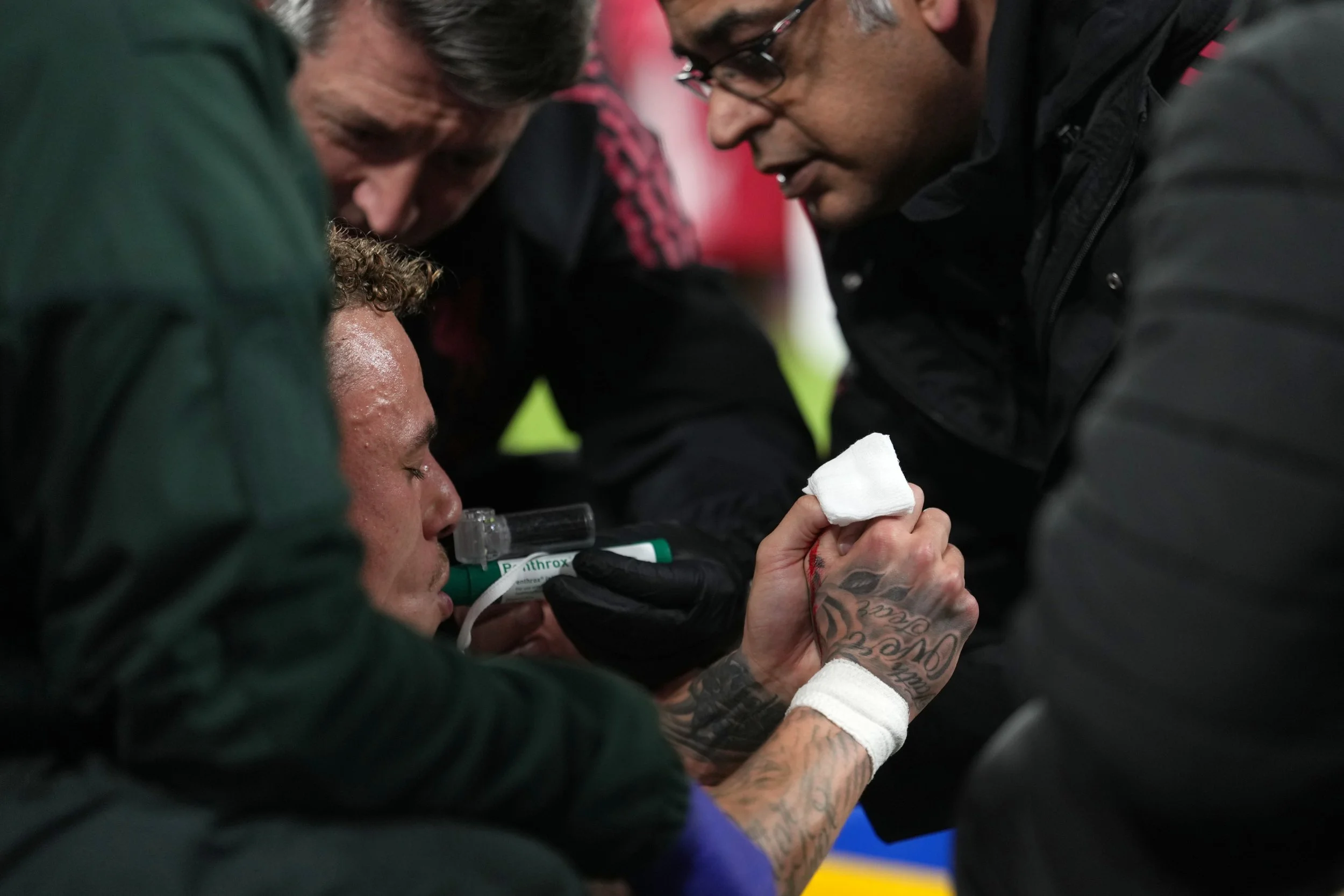 Galatasaray's Noa Lang receives medical treatment after sustaining an injury during the second leg of the Champions League round of 16 soccer match between Liverpool and Galatasaray, in Liverpool, England, Wednesday, March 18, 2026. (AP Photo/Jon Super)
